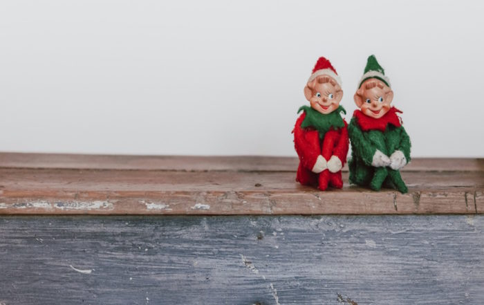 Elves of Cologne sitting together and smiling.