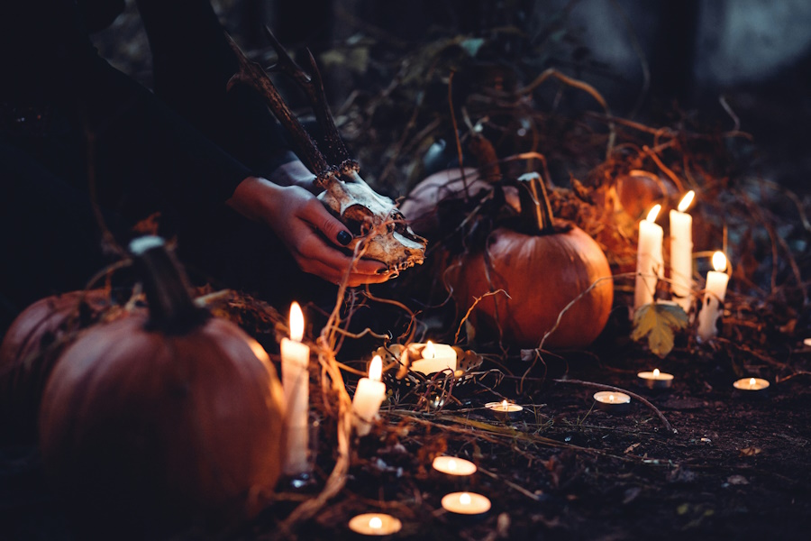 Halloween Witchcraft Altar with Skull, Pumpkins and Candles