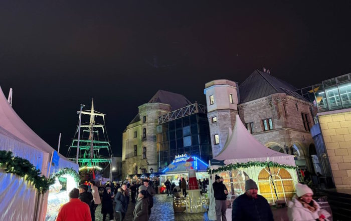 Christmas Markets Evening Atmosphere with Illuminated Ship Display